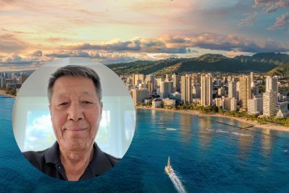 Alumnus Hong S. Kim headshot overlaid on Honolulu skyline
