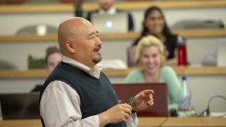 A professor addresses a classroom