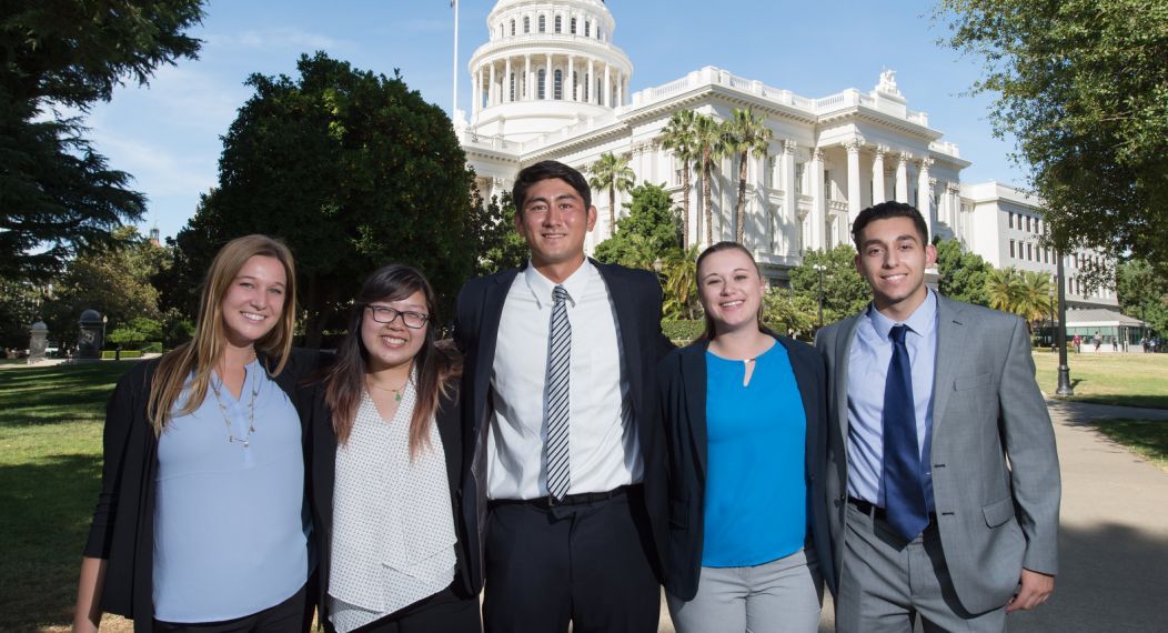 Students standing in front of Capitol building 