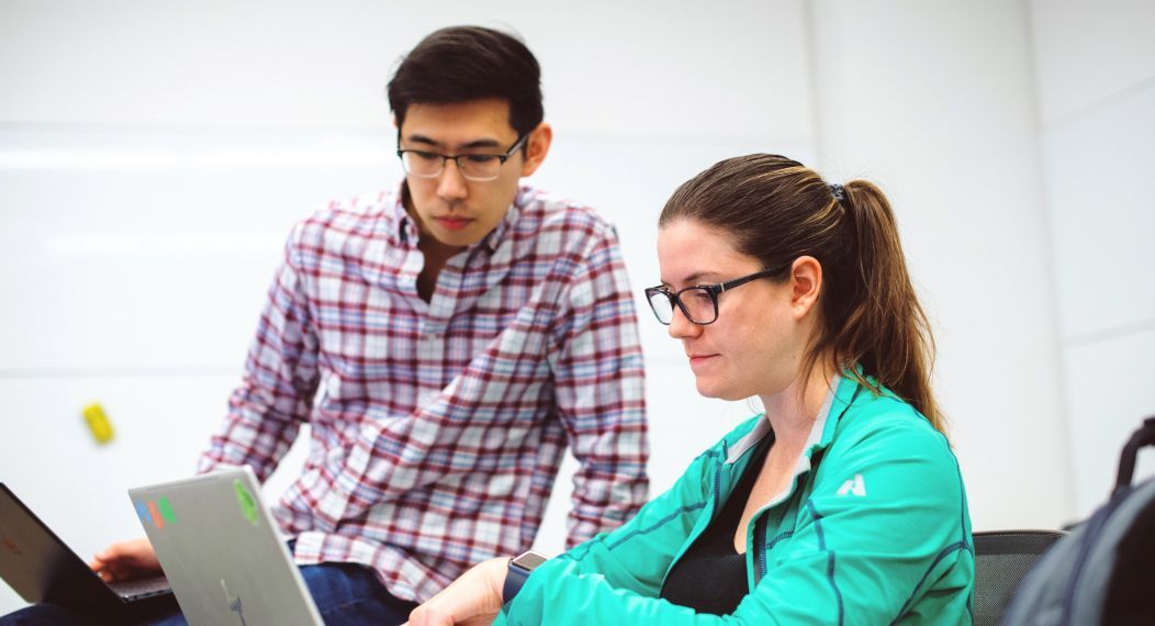 Students studying at laptop