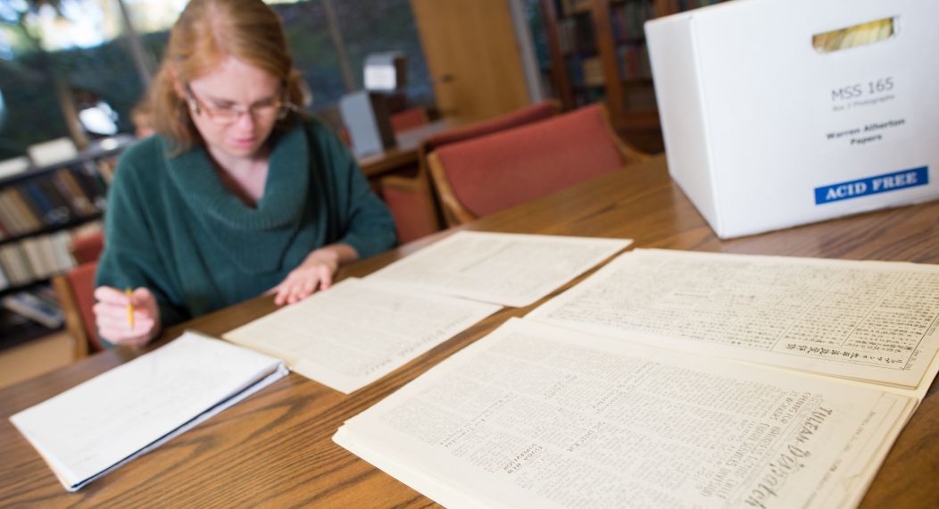 Archives spread out on a table in Special Collections