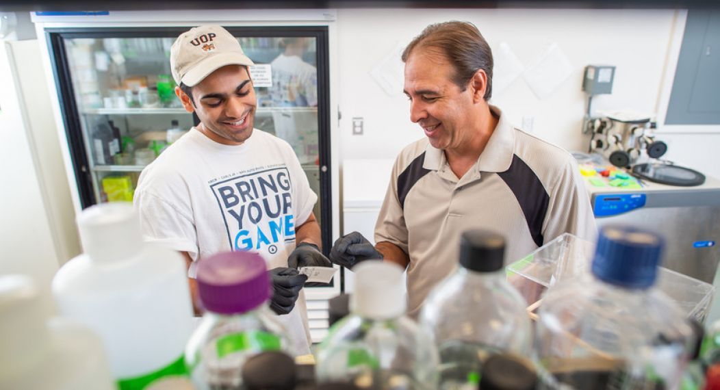 student and professor in the lab