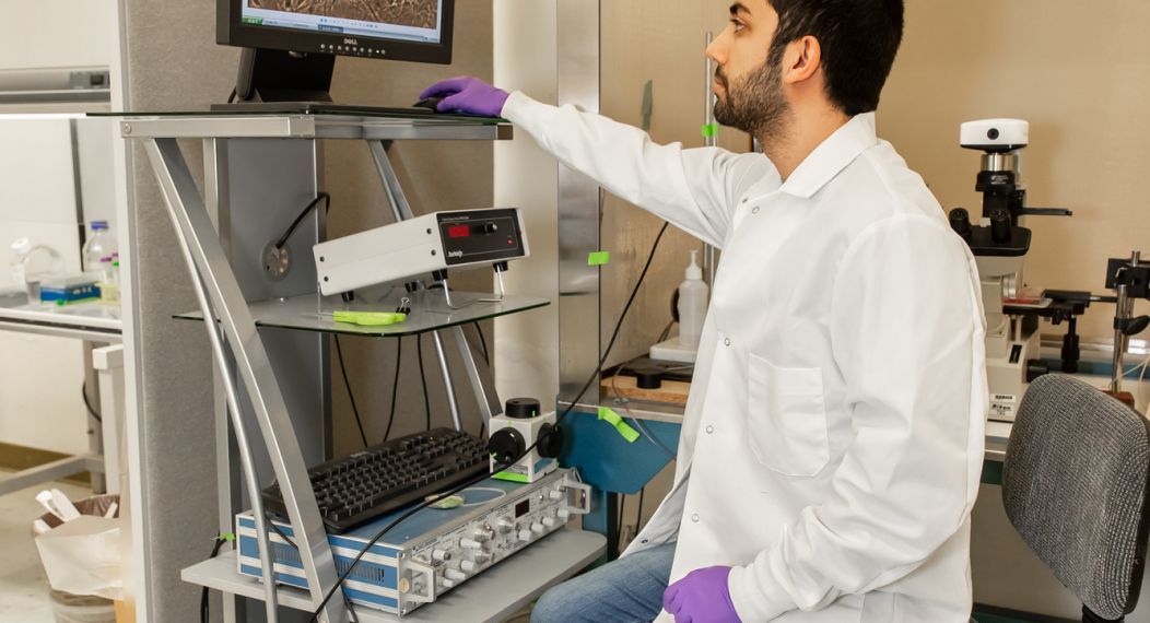 student in lab looking at computer