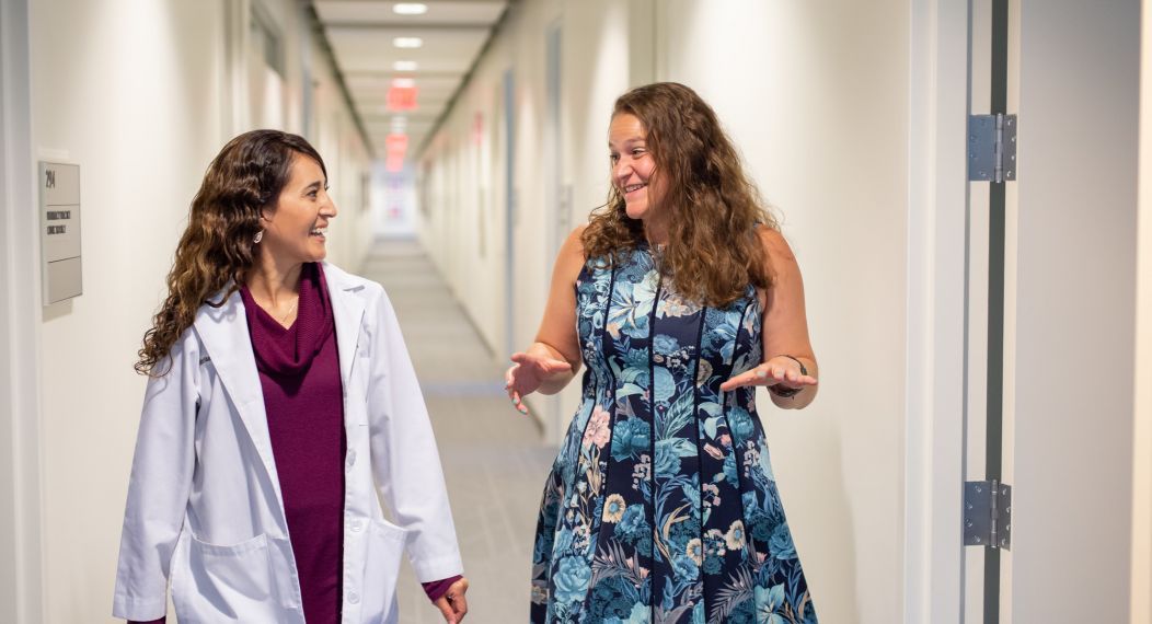 clinical students walking down hallway