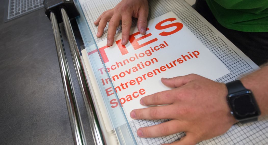 TIES sign being made.