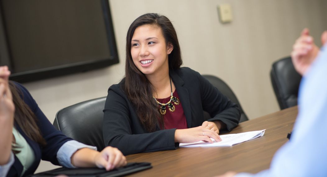 woman sitting at business meeting