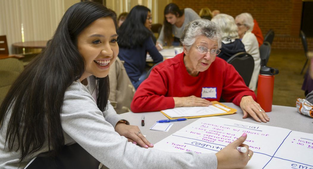 Pacific students and OLLI members discuss together