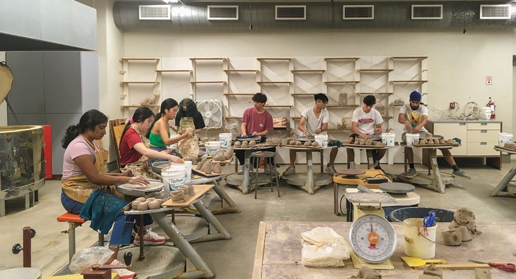Ceramics students working with clay