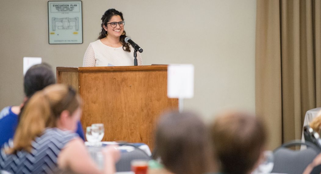 Pacific alumna Marukh Hasan speaking at an event