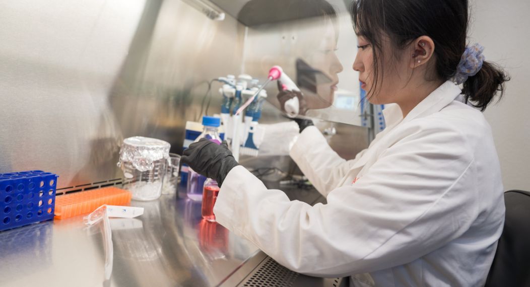 a student running an experiment during the Curing Cancer program