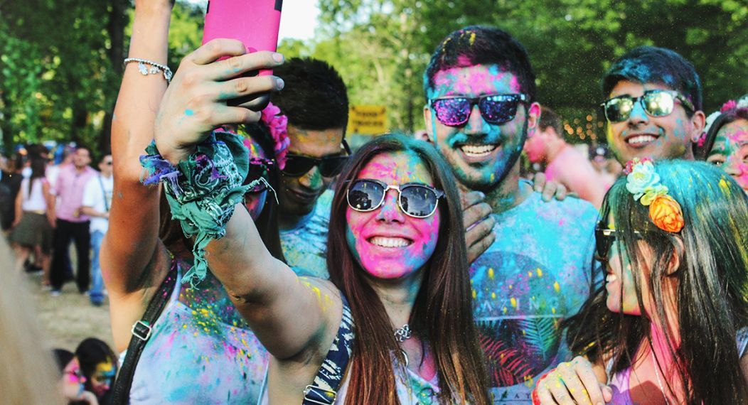 Students at a color run taking a photo