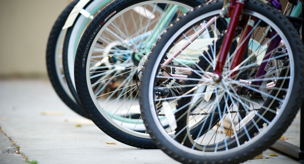 the front tires of a row of bicycles