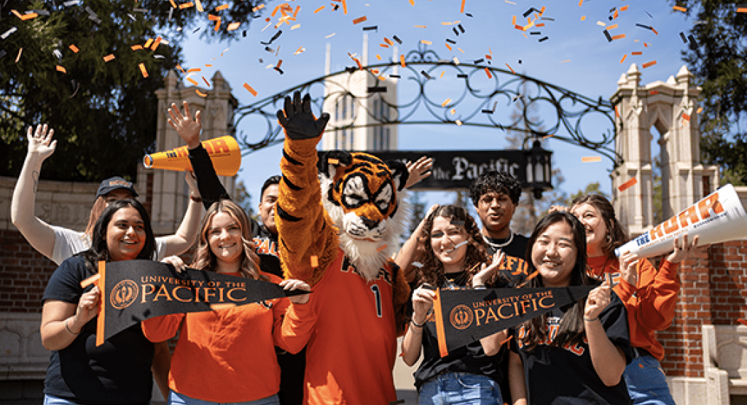 Powercat and students with confetti at the Pacific gate