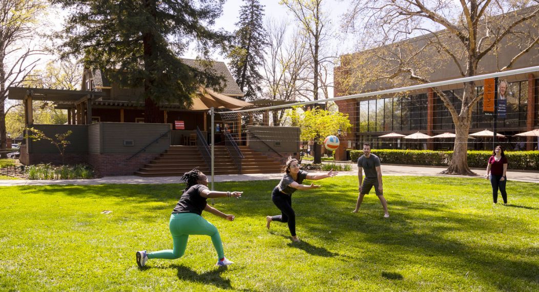 students play volleyball