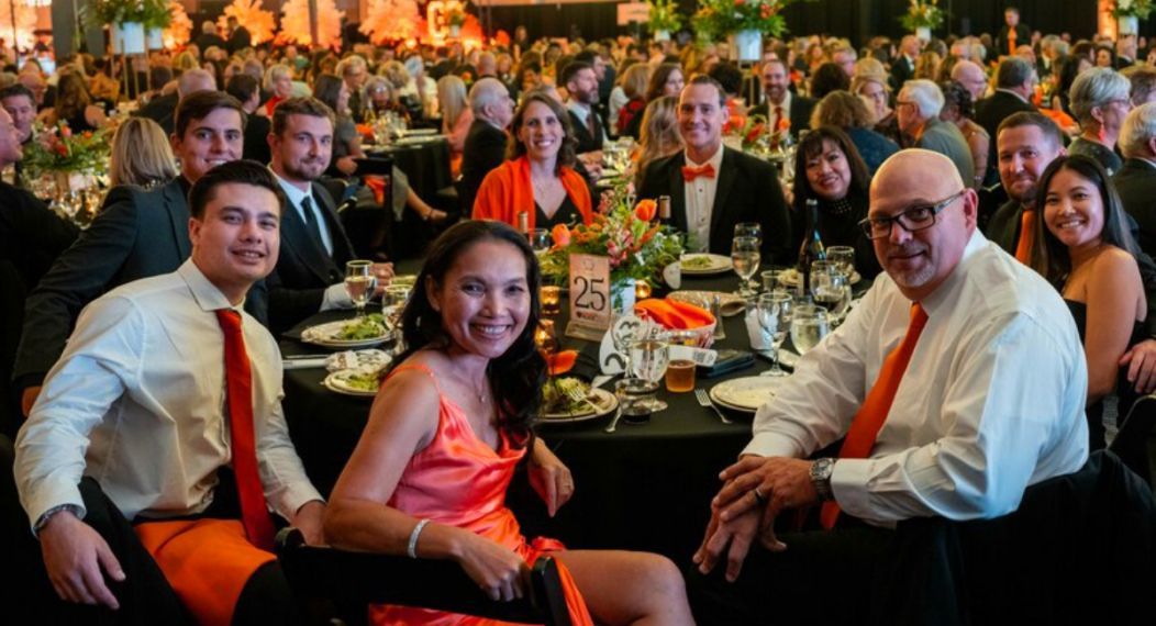 a room full of well-decorated tables and well-dressed people