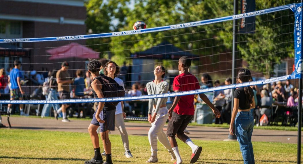 students playing volleyball casually