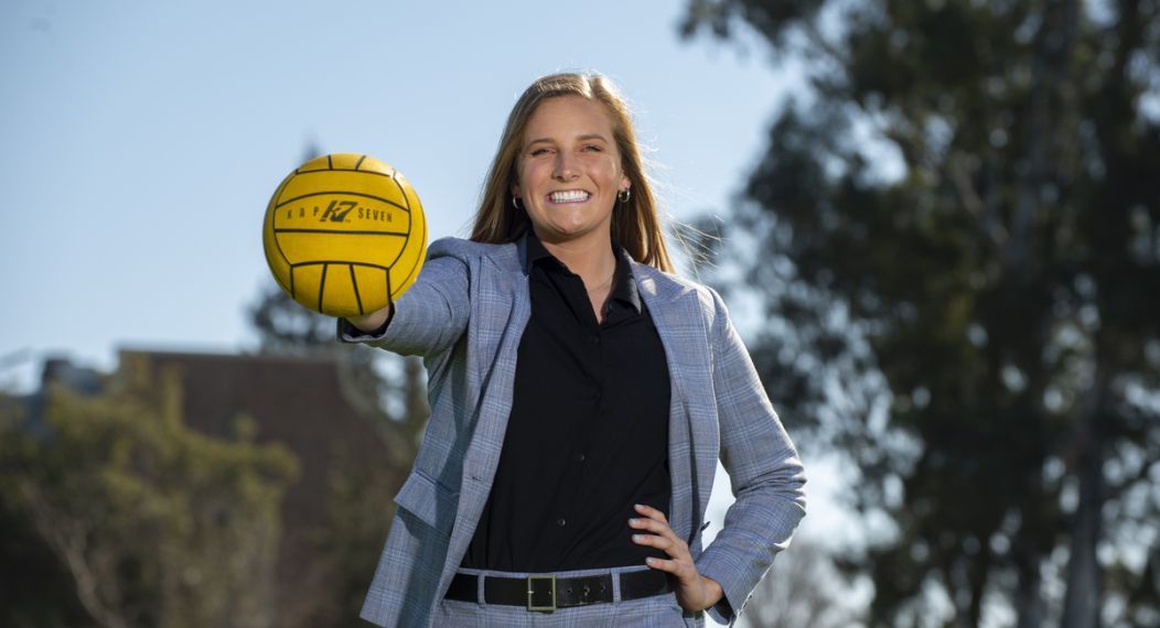 Female student holding water polo ball