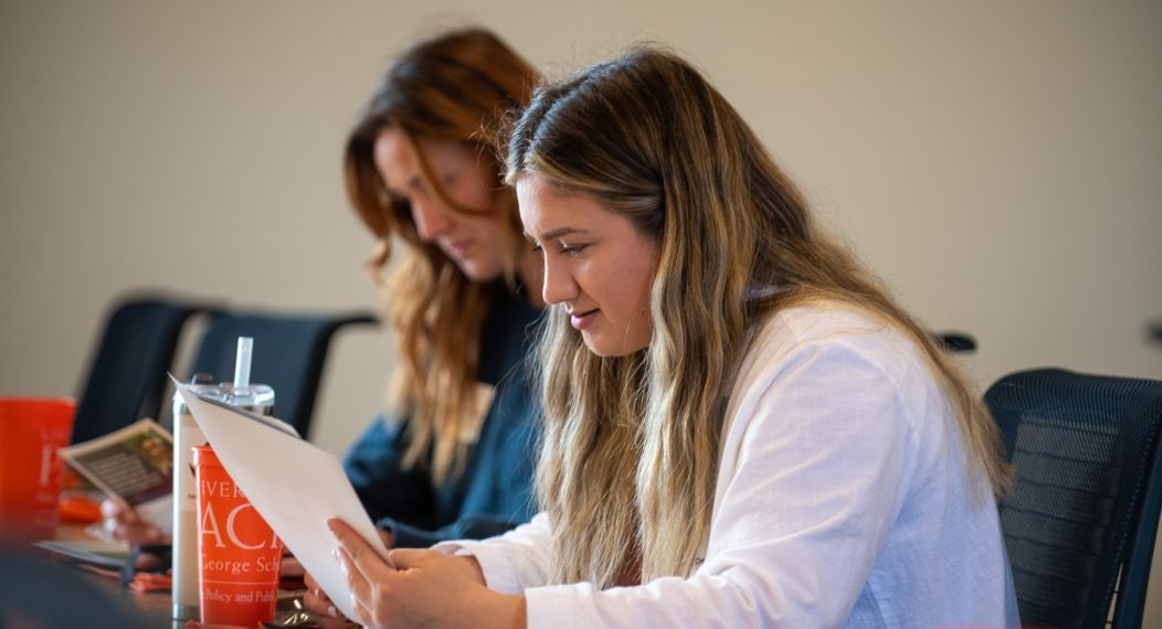 Photo of a student reading a handout