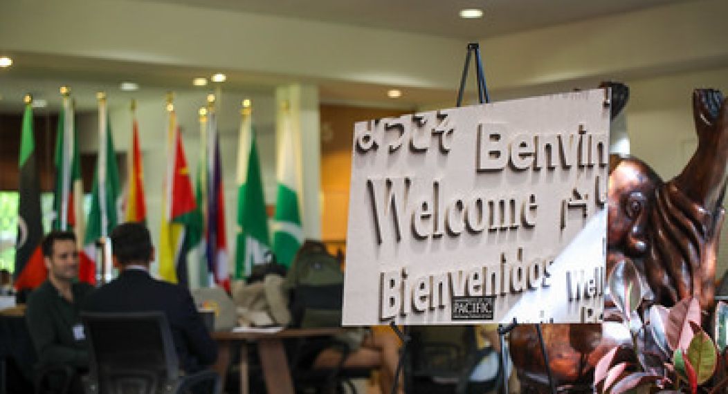 signage that says welcome in multiple languages