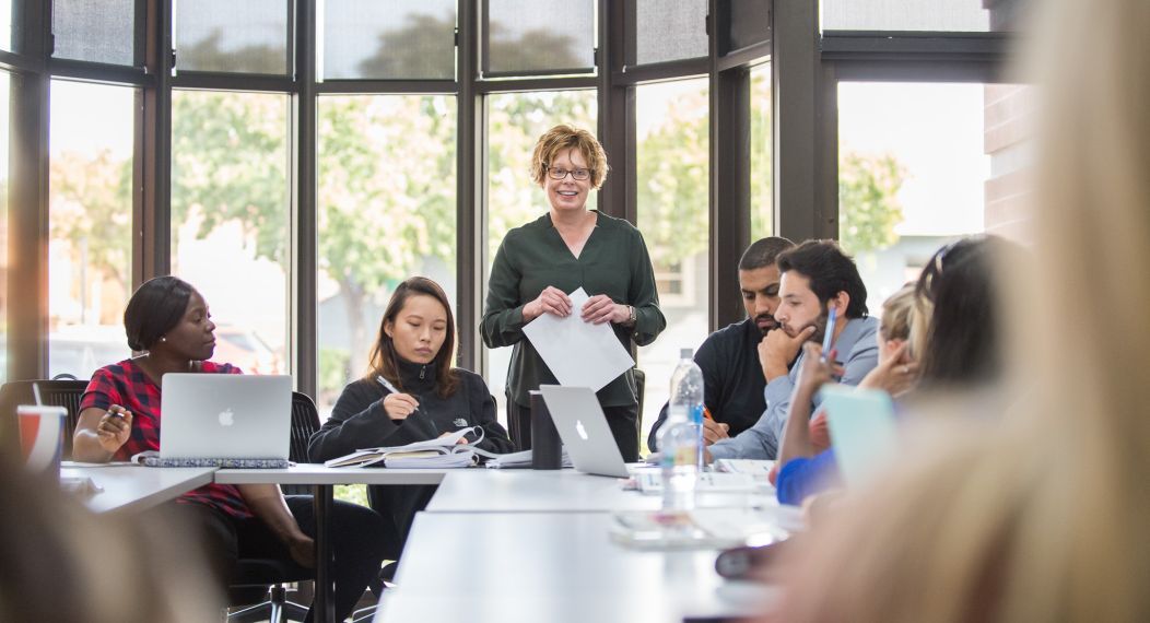 classroom with professor at the center