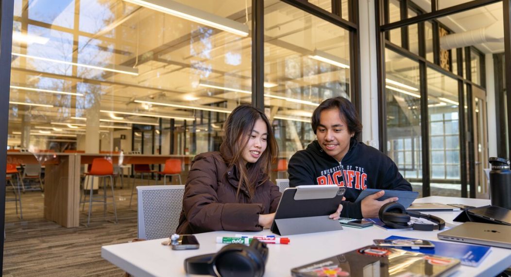 students studying together in the library