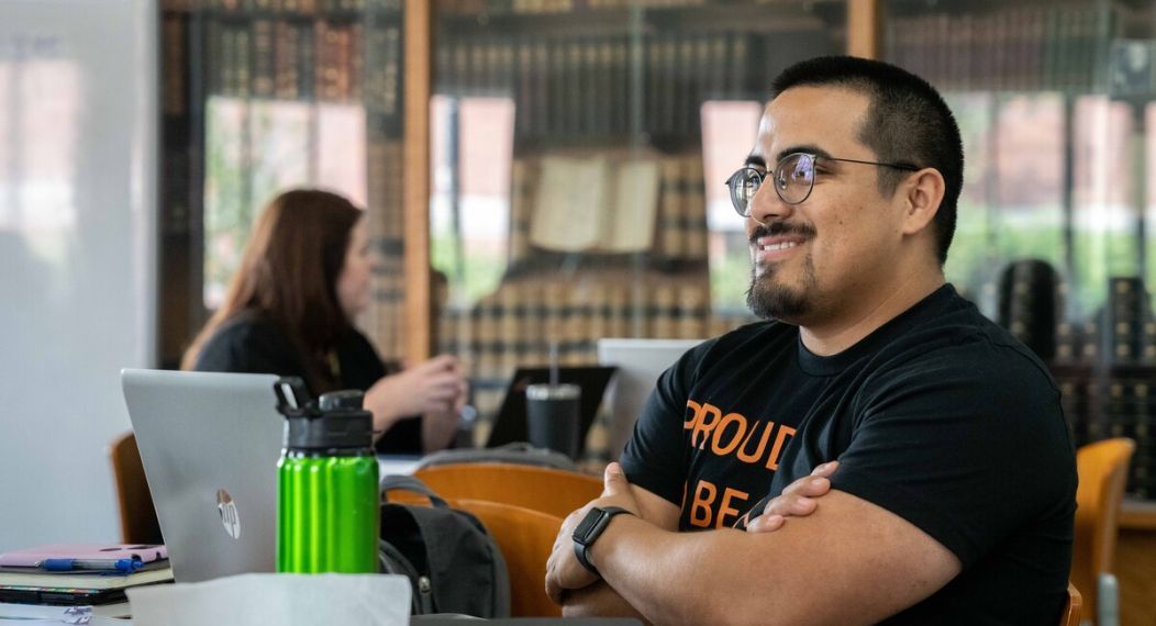 a student in the Sacramento Campus library