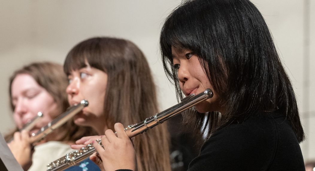 Students playing flutes