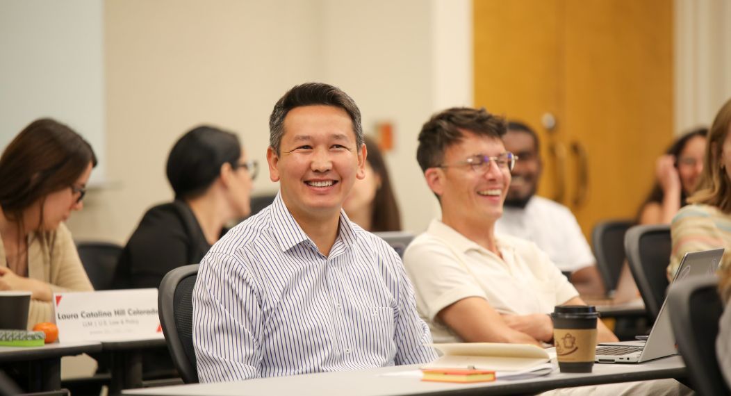 a student smiling in class