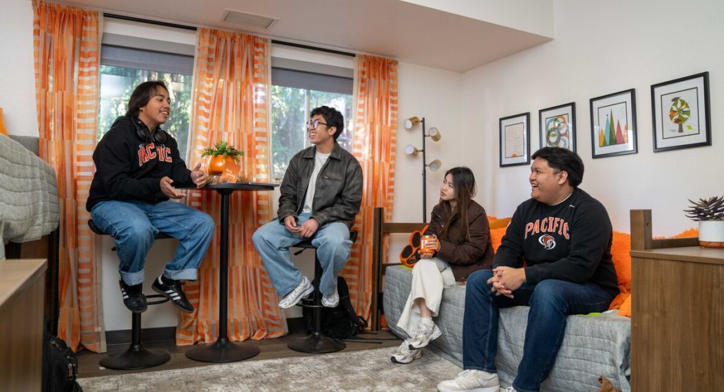 a group of students in a dorm room