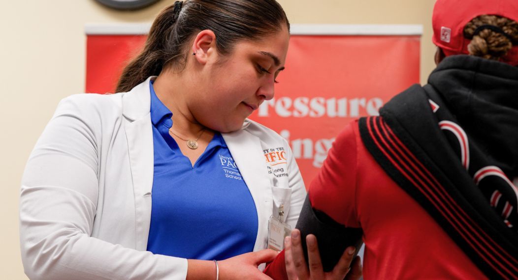 Doctor of pharmacy student with patient at diabetes clinic