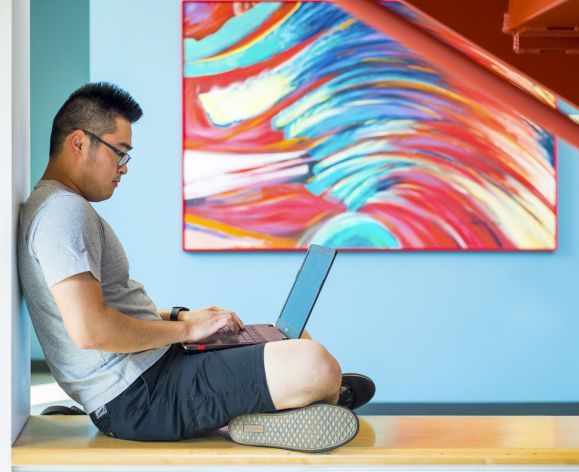 Pacific student on laptop 