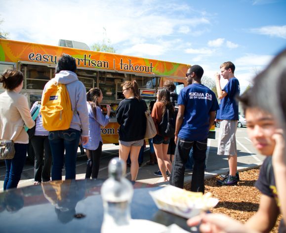 Students standing in front of EAT truck