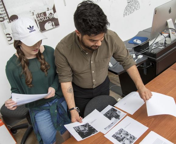 Students examining printed documents