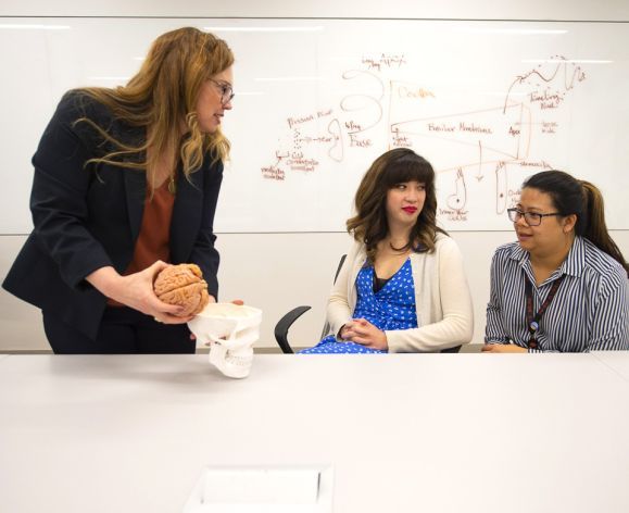 audiology professor with students in classroom