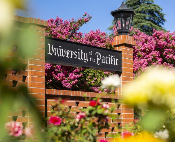 University of the Pacific sign surrounded by roses