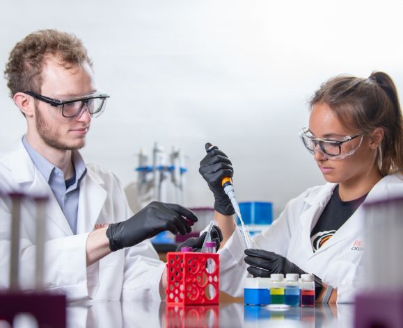 two chemistry students in a lab