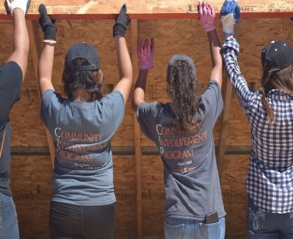 CIP scholars building a house