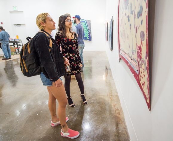 students looking at paintings