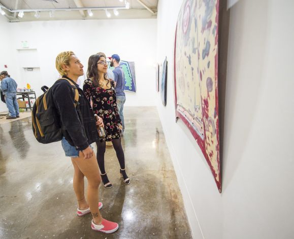 students looking at paintings