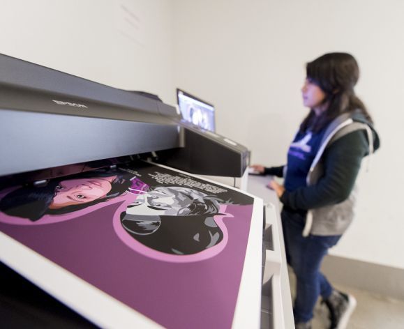 graphic design student printing poster