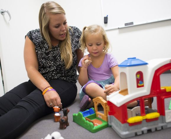 student working with child