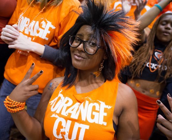 student celebrating at basketball game