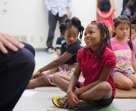 young students listening to storytime