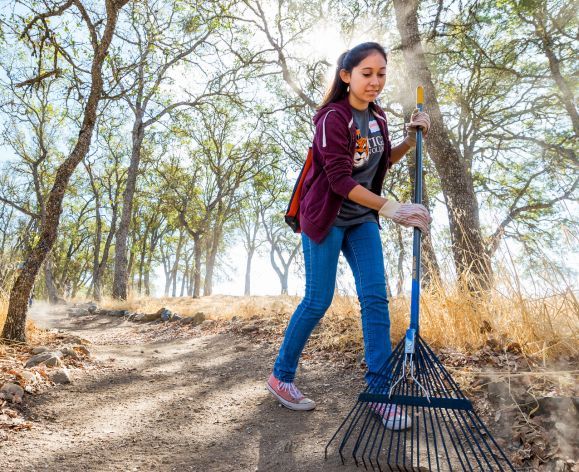 student volunteering outdoors