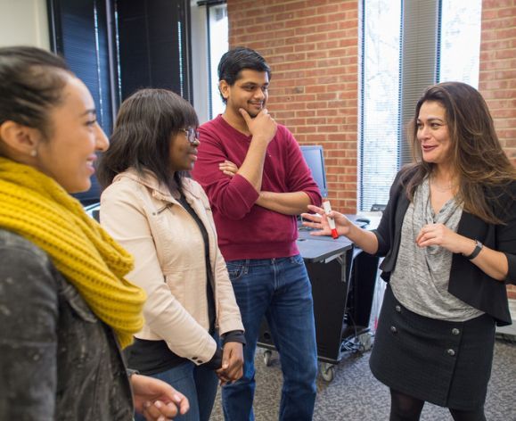 Economics professor Sharmila King and students