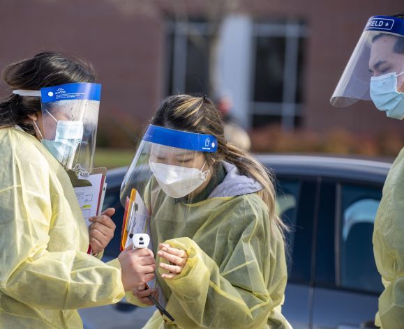 Vaccinations for the Covid-19 virus are given in the parking lot outside of the Chan Center