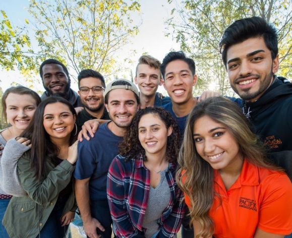diverse group of students smiling at camera