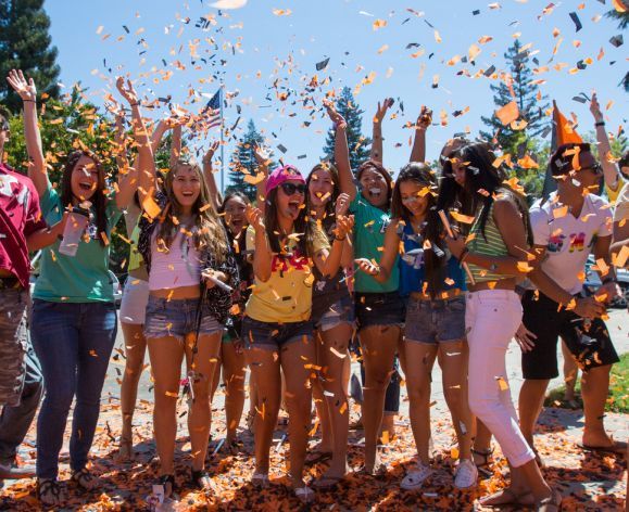 students celebrating with confetti