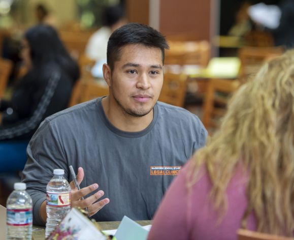 Law student advising at immigration clinic