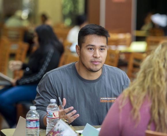 Law student advising at immigration clinic